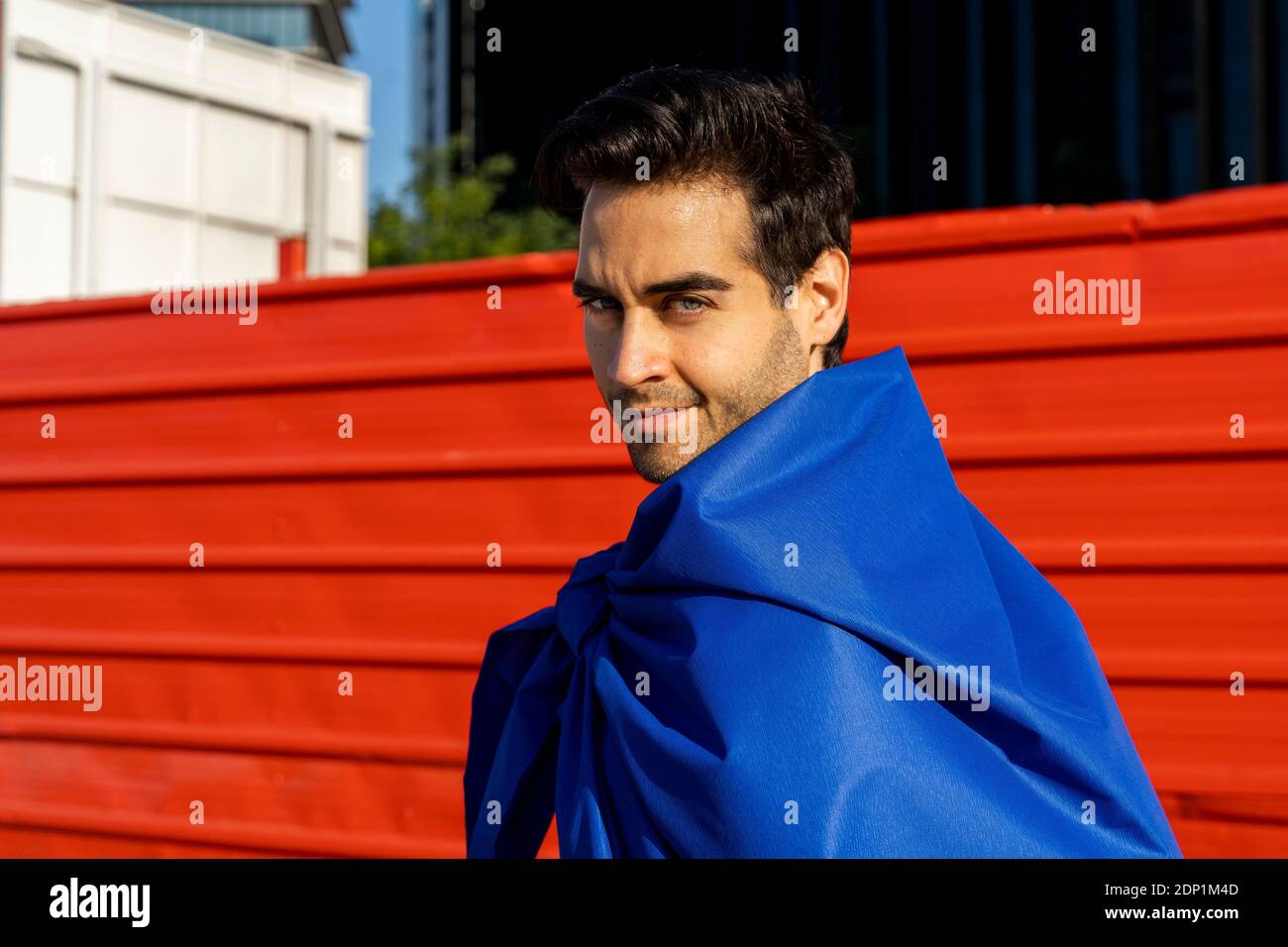 Portrait of confident man wearing superhero cape Stock Photo - Alamy