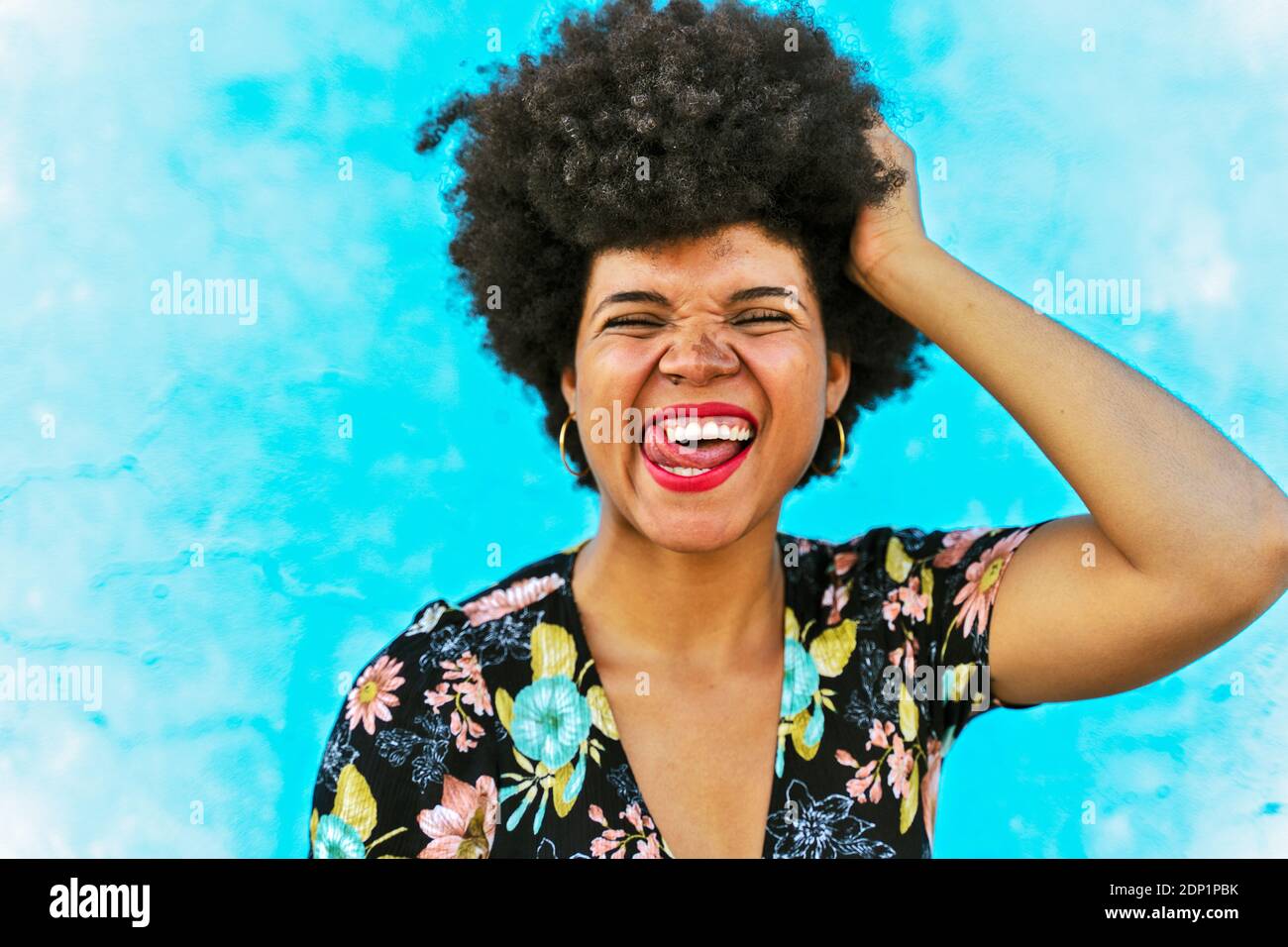 Portrait of female Afro-American woman, hand in hair Stock Photo
