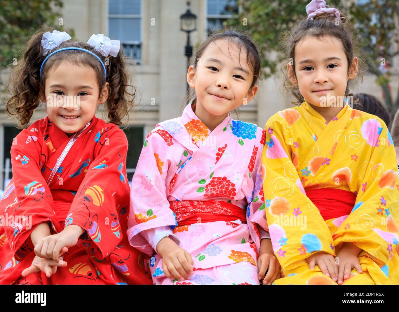 Three little girls in kimono at Japan Matsuri Festival on Trafalgar Square, London, UK Stock Photo