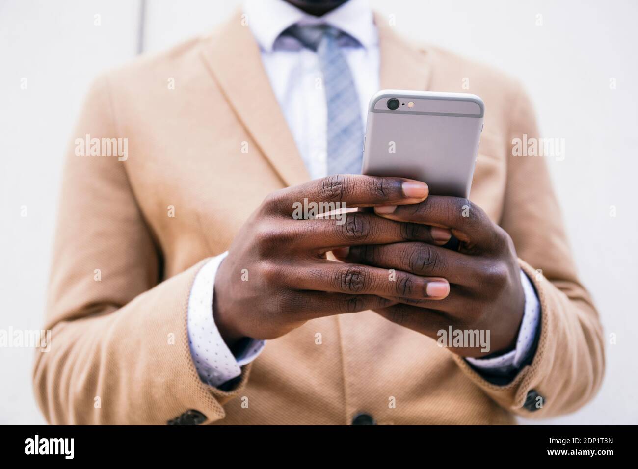 Hands of a businessman using smartphone Stock Photo