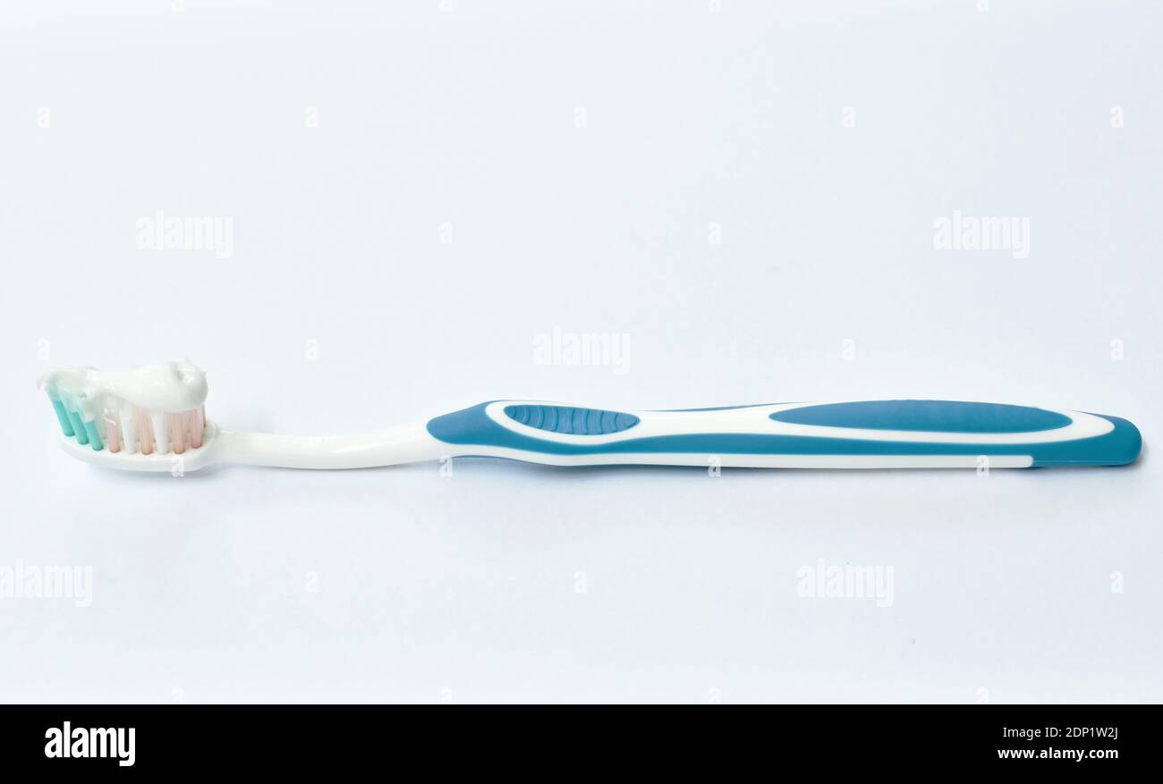 toothpaste on toothbrush arranging on white background Stock Photo - Alamy