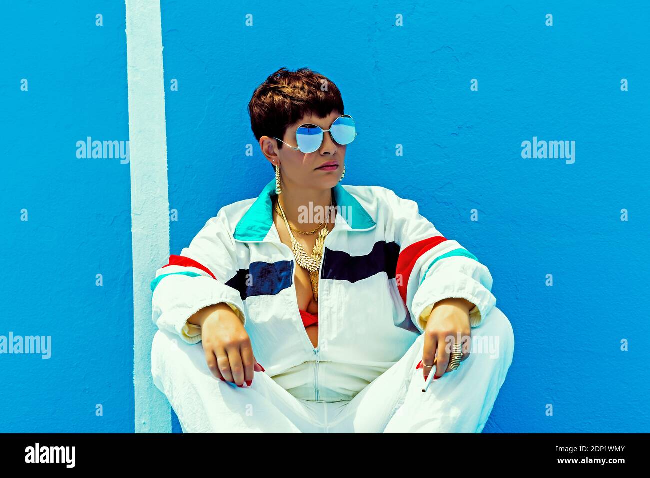 Woman wearing swag style and sunglasses Stock Photo