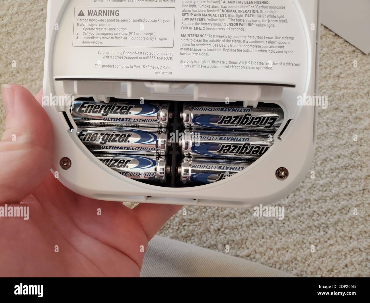Close-up shot of the back of the Google Nest Protect smoke and carbon  monoxide alarm, showing Energizer batteries in the battery compartment, in  Lafayette, California, December 6, 2020 Stock Photo - Alamy
