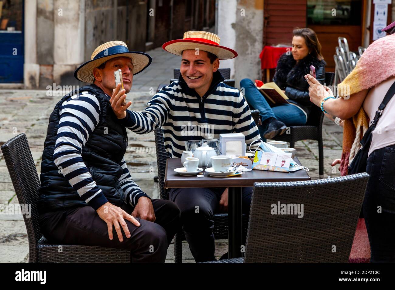 Two Gondoliers Taking A Selfie, Venice, Italy. Stock Photo