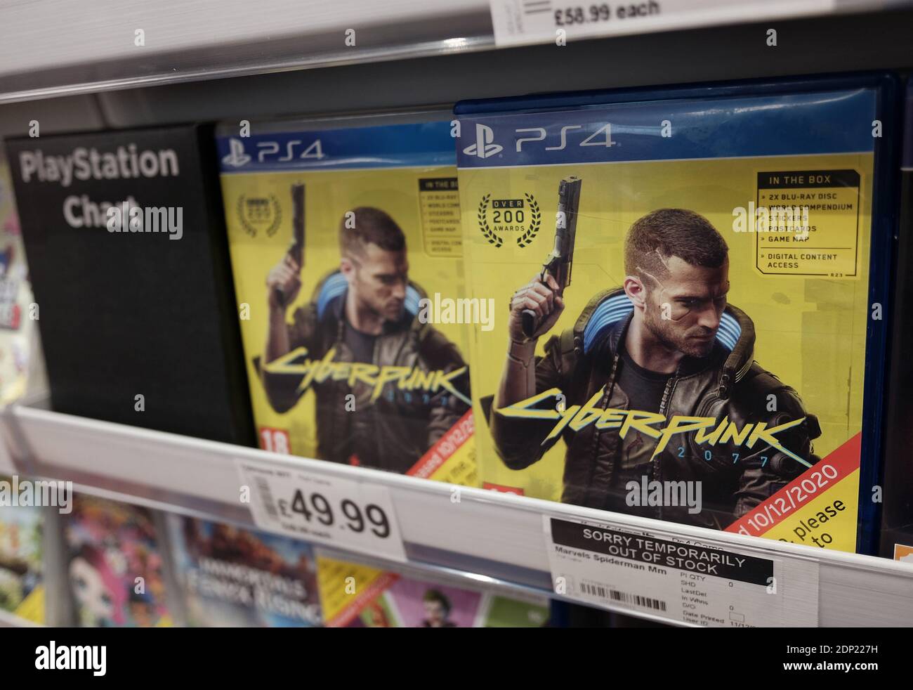 Physical copies of the PlayStation 4 video game Cyberpunk 2077 for sale in  a supermarket in London Stock Photo - Alamy