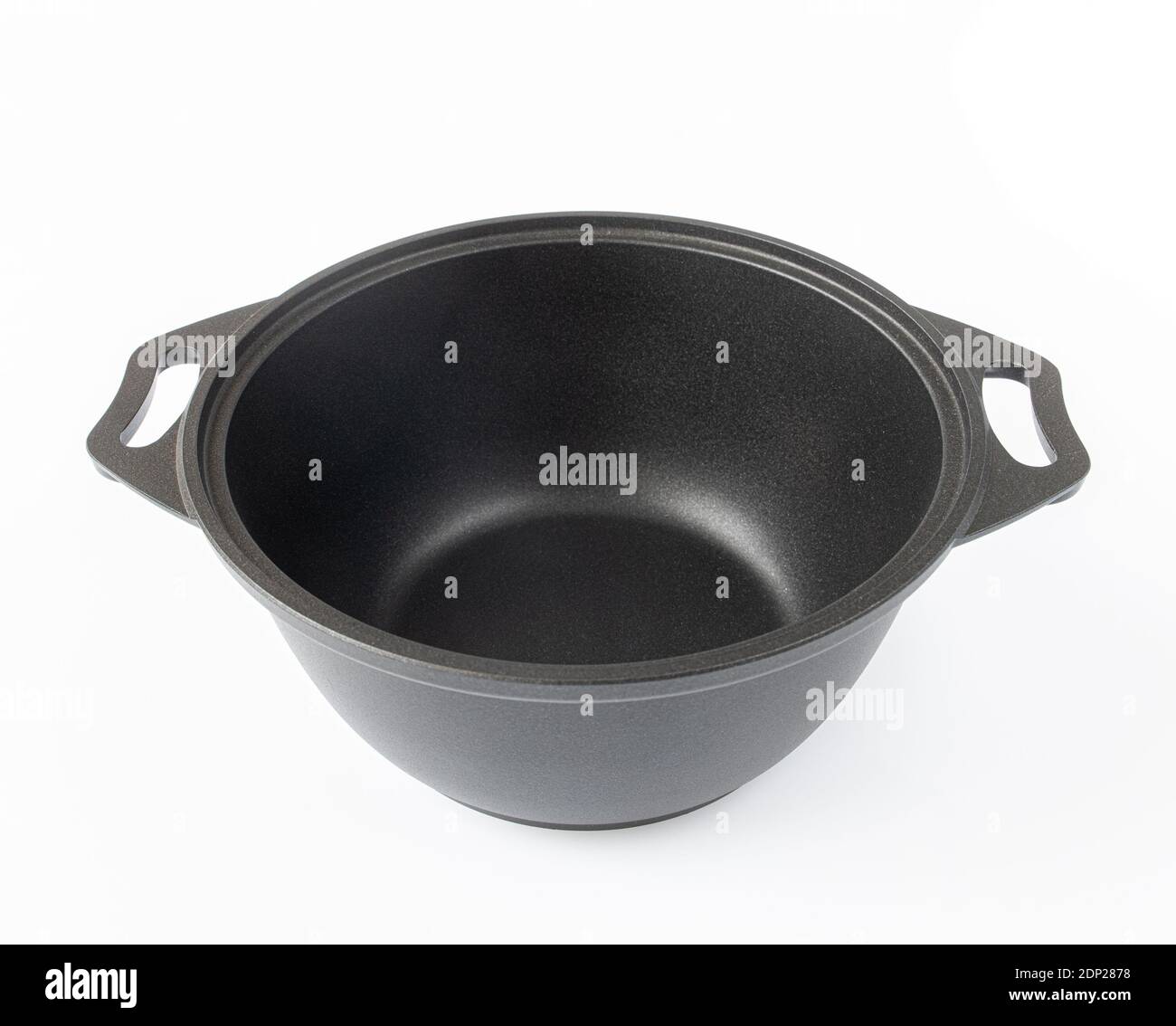 Black cast iron pan on a light background Stock Photo