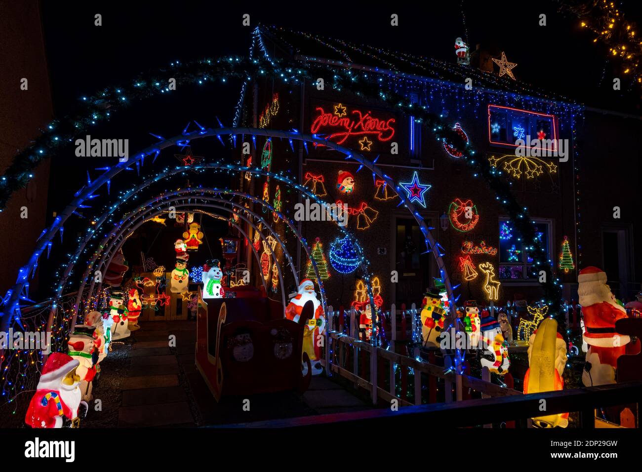 huge-christmas-decorations-in-the-front-garden-of-a-house-lit-up-at