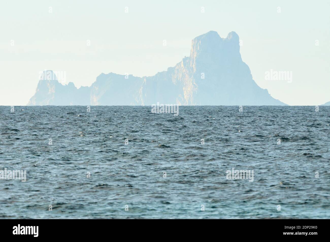 Panoramic view of Es Vedrá island silhouette seen from Formentera (Pityusic Islands, Balearic Islands, Mediterranean sea, Spain) Stock Photo