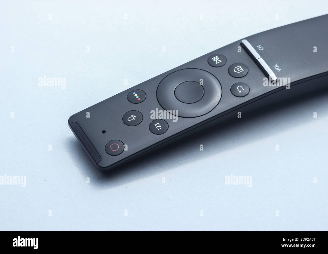 Close up tv remote on gray background. Stock Photo