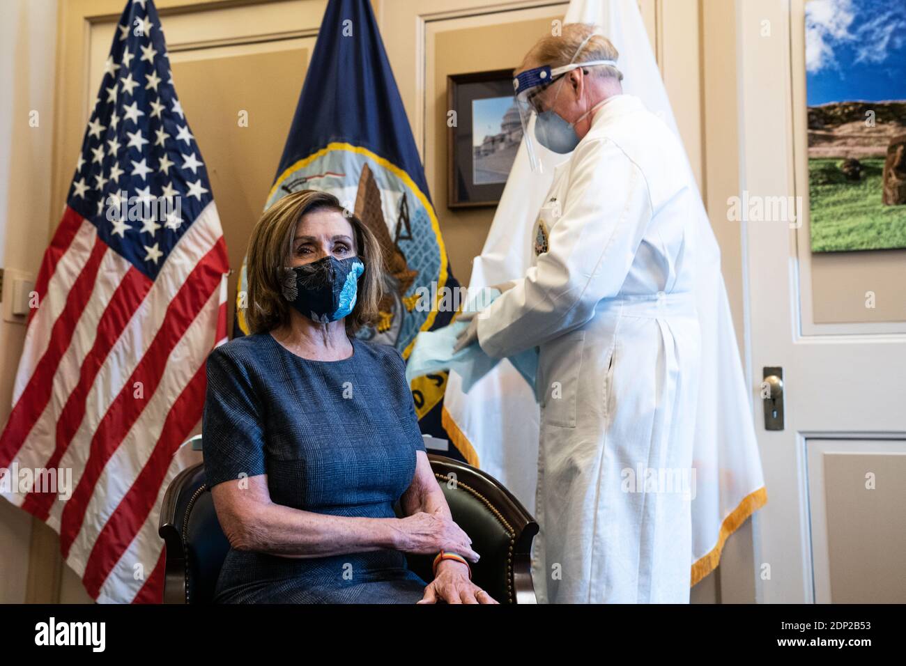 Speaker of the United States House of Representatives Nancy Pelosi (Democrat of California), sits and waits before being inoculated with the Pfizer-Biontech COVID-19 vaccine in the US Capitol Building in Washington DC on December 18th, 2020.Credit: Anna Moneymaker/Pool via CNP /MediaPunch Stock Photo