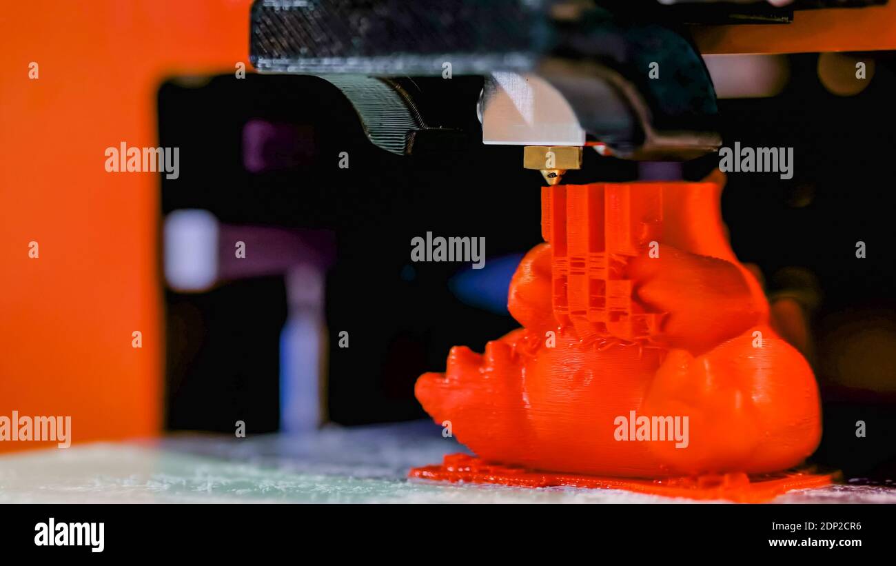 Three dimensional printing machine prints physical 3D model Stock Photo
