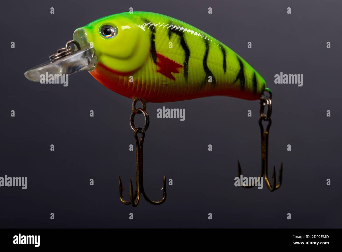 Brightly coloured hand-made fishing lure. Stock Photo