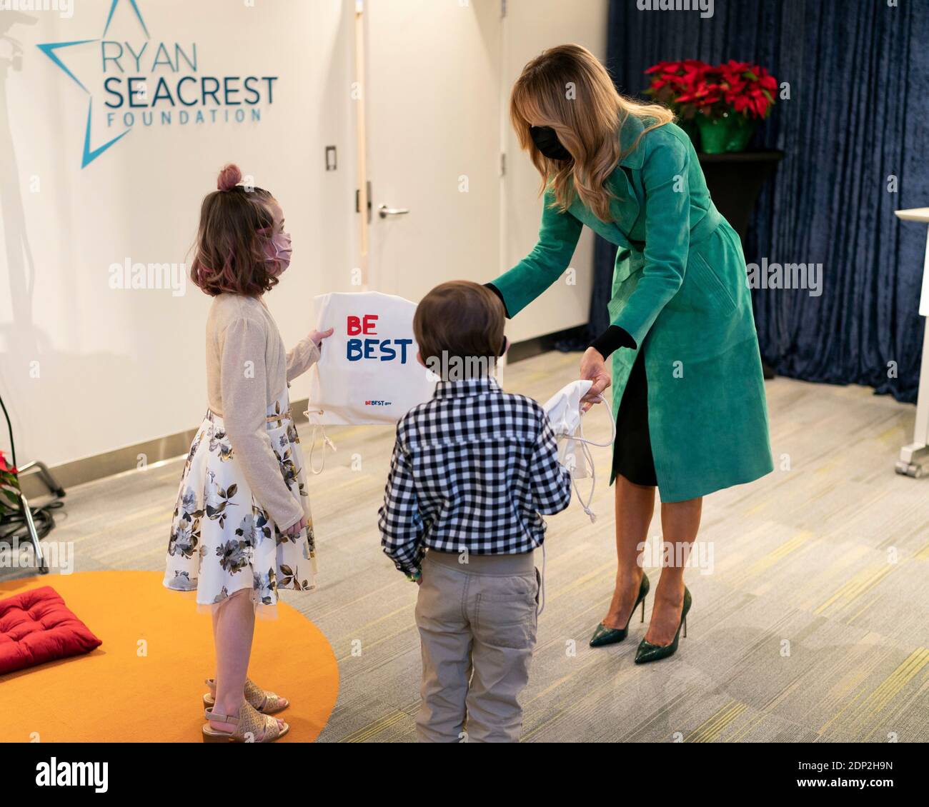 Washington, United States Of America. 15th Dec, 2020. U.S. First Lady Melania Trump hands BeBest gifts to 8 year-old patient Sofia Martinez and 6 year-old patient Riley Whitney during a Christmas visit to Children's National Hospital December 15, 2020 in Washington, DC Credit: Planetpix/Alamy Live News Stock Photo