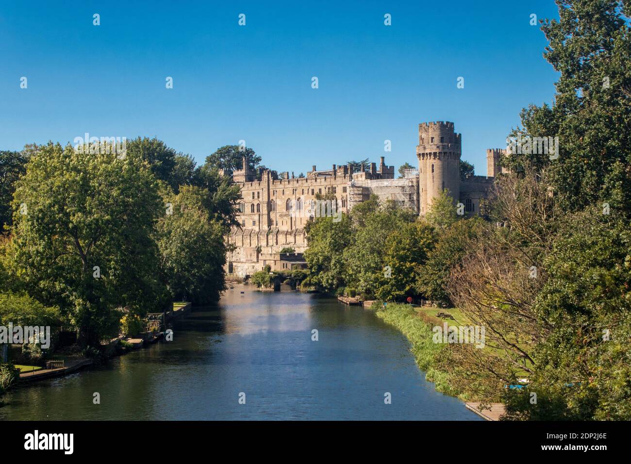 Warwick Castle and the River Avon landscape taken from a bridge over the river Stock Photo