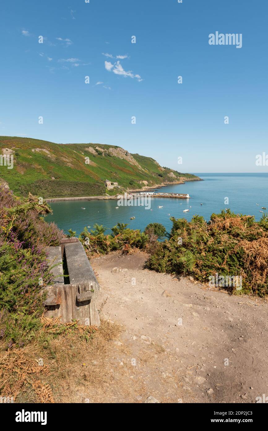 Summer time, Sunny day, Bouley Bay, Jersey, Channel Islands. View from cliff path. Pier, fort, coastline. Portrait orientation. Stock Photo