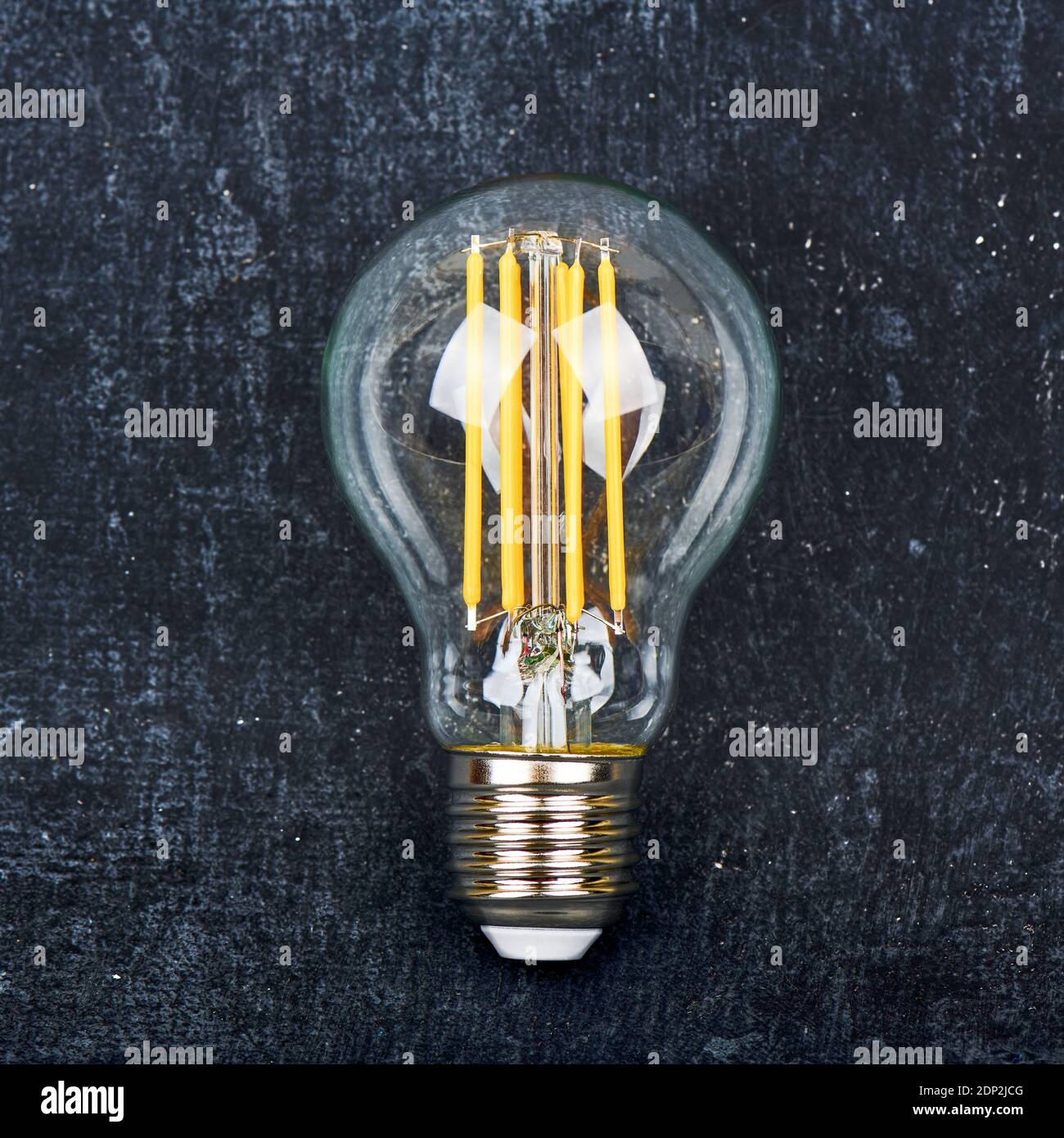 LED lamp bulb, transparent, close-up on dark background Stock Photo