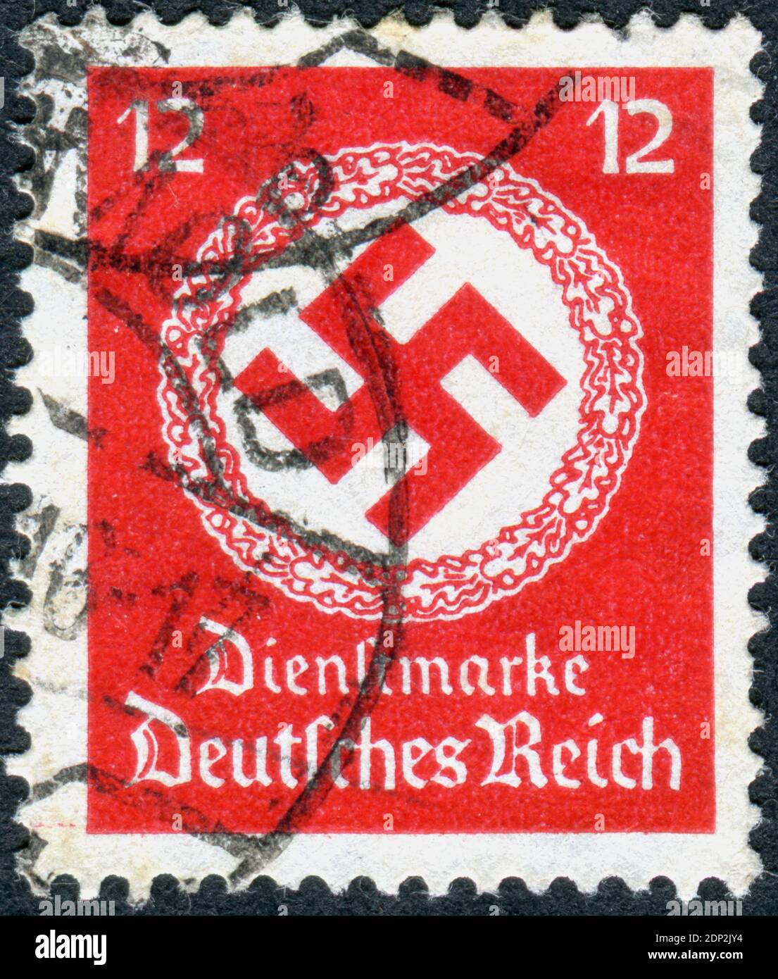 GERMANY - CIRCA 1934: Postage stamp (official stamp) printed in Germany, shown a Swastika in a wreath of oak - symbol of Nazi, circa 1934 Stock Photo