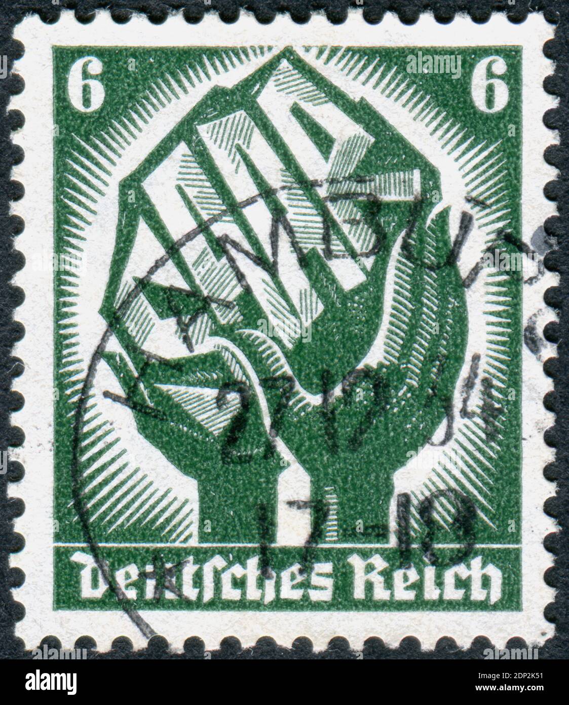 GERMANY - CIRCA 1934: Postage stamp printed in Germany, dedicated to Saar plebiscite on January 13, 1935, shown a two hands holding a piece of coal with inscription 'Saar', circa 1934 Stock Photo