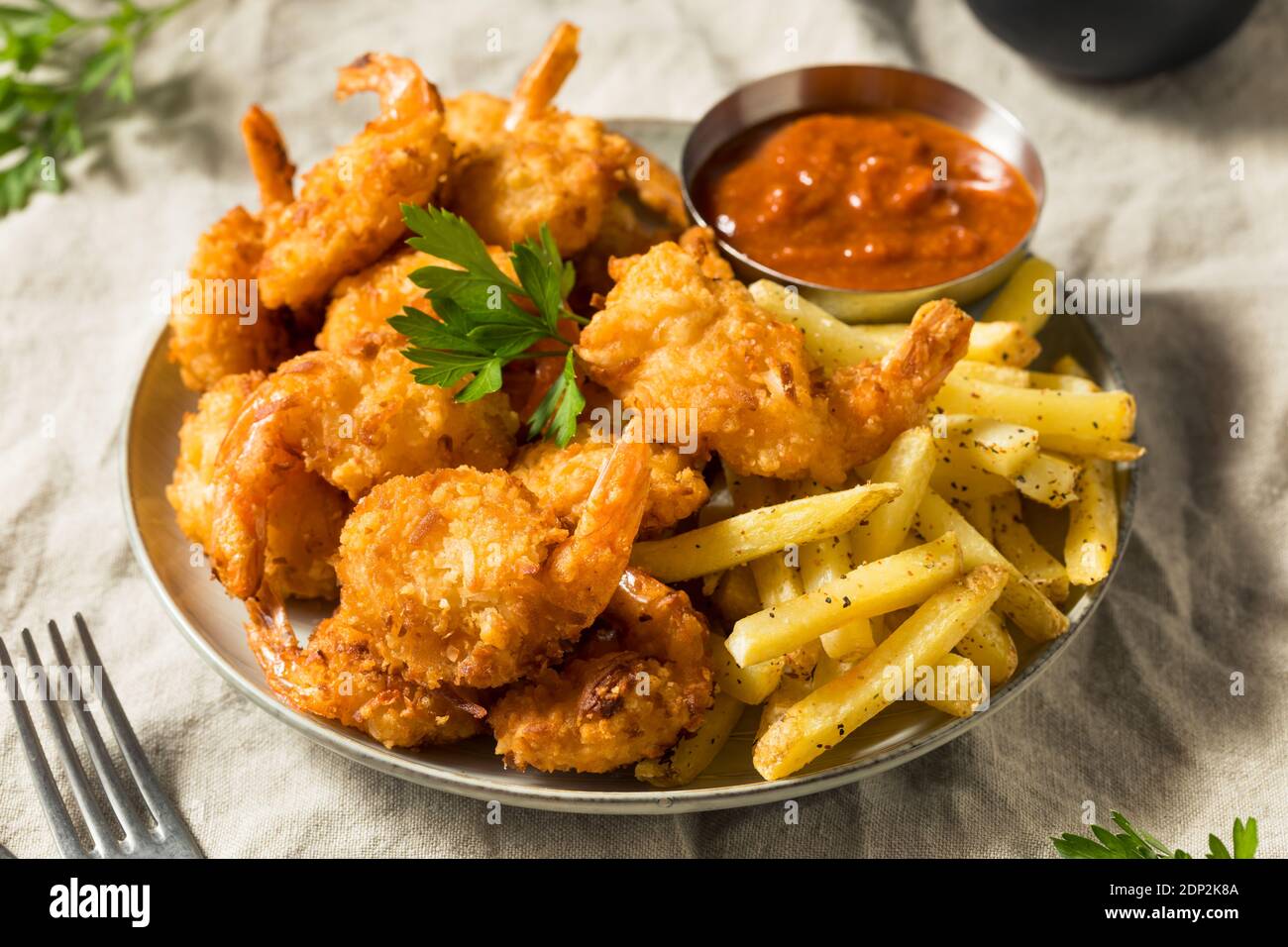 Homemade Deep Fried Coconut Shrimp with Fries and Cocktail Sauce Stock