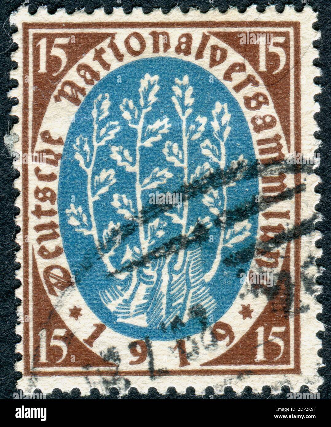 GERMANY - CIRCA 1919: A postage stamp printed in Germany, Republic National Assembly Issue, shown a New Shoots from Oak Stump Symbolical of New Government, circa 1919 Stock Photo