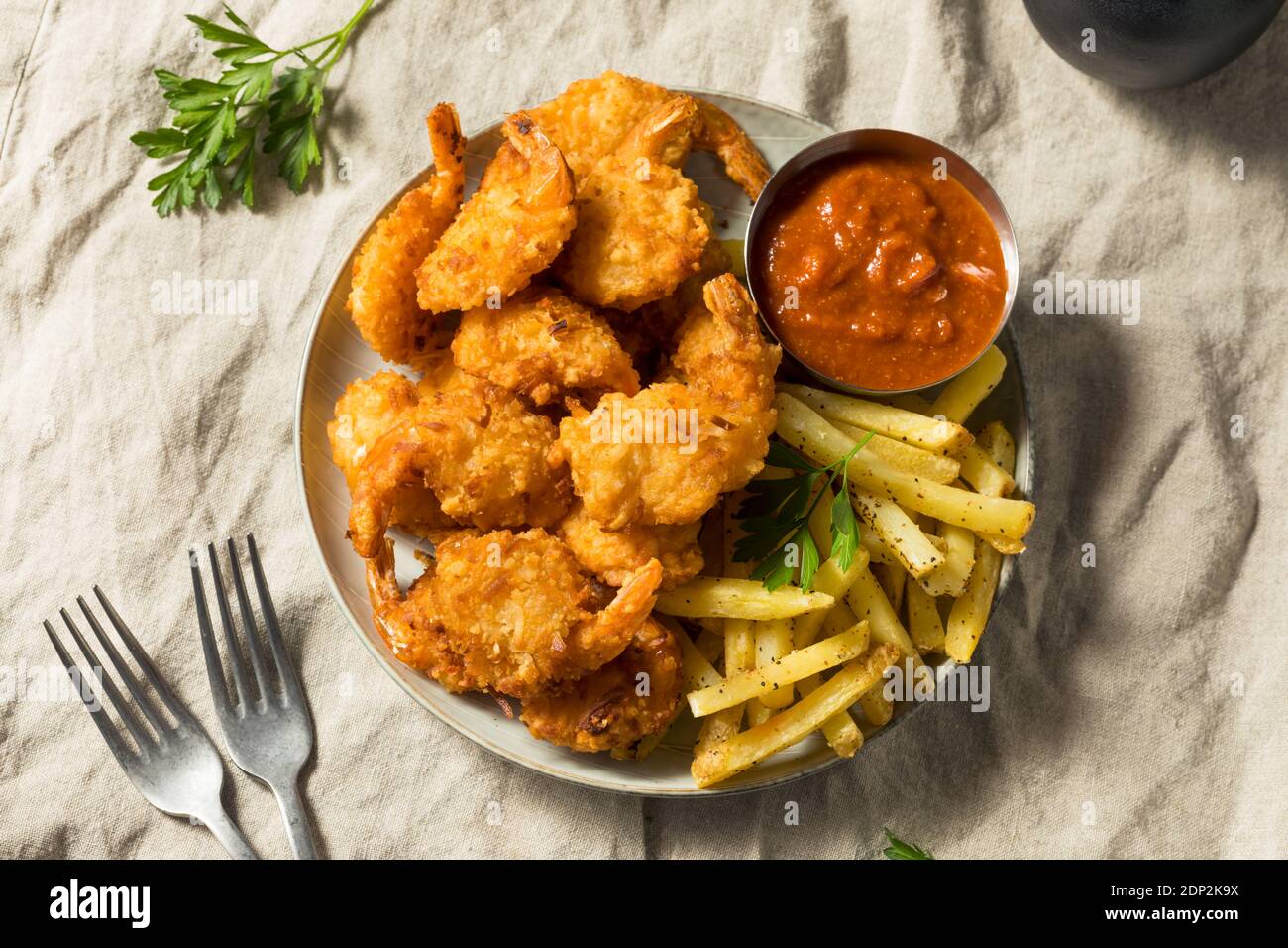 Homemade Deep Fried Coconut Shrimp with Fries and Cocktail Sauce Stock Photo