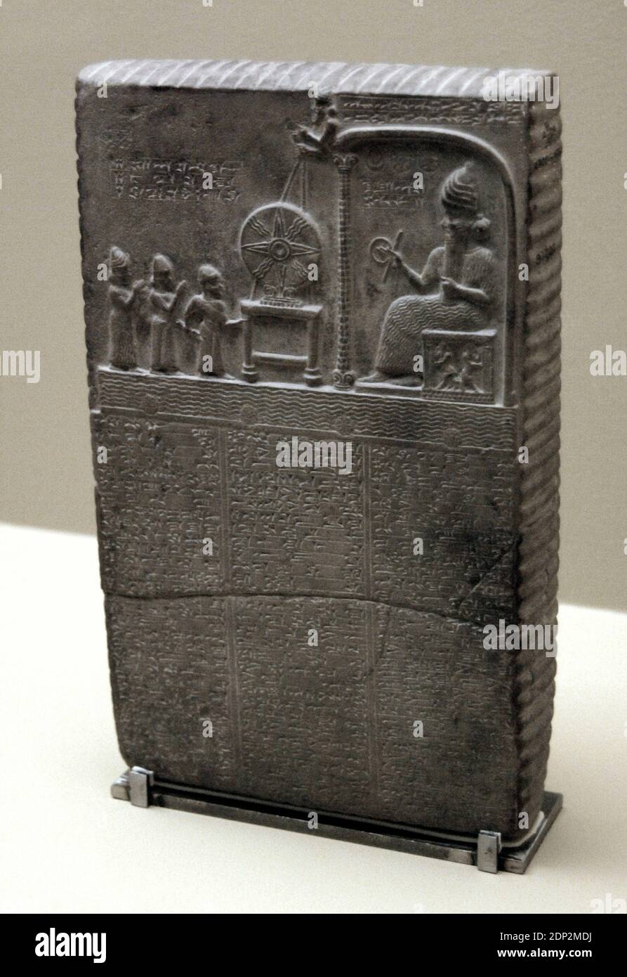 The Sun God Tablet. Limestone. The scene carved in the relief represents Nabu-aplu-iddina being led by the priest Nabu-nadin-shum and the goddess Aa into the presence of the Sun-god, woh is seated within Ebabbara. Before the god is the solar disc. Middle Babylonian. Neo-Babylonian Dynasty. 860 BC-850 BC. Sippar, Iraq, Middle East. British Museum. London, England, United Kingdom. Stock Photo