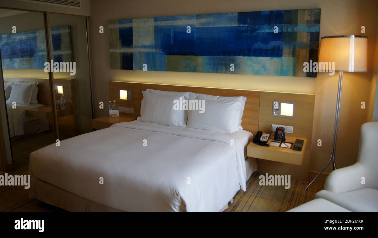 KUALA LUMPUR, MALAYSIA 4 APRIL 2015 A bedroom with a large bed in a luxury hotel room in Asia