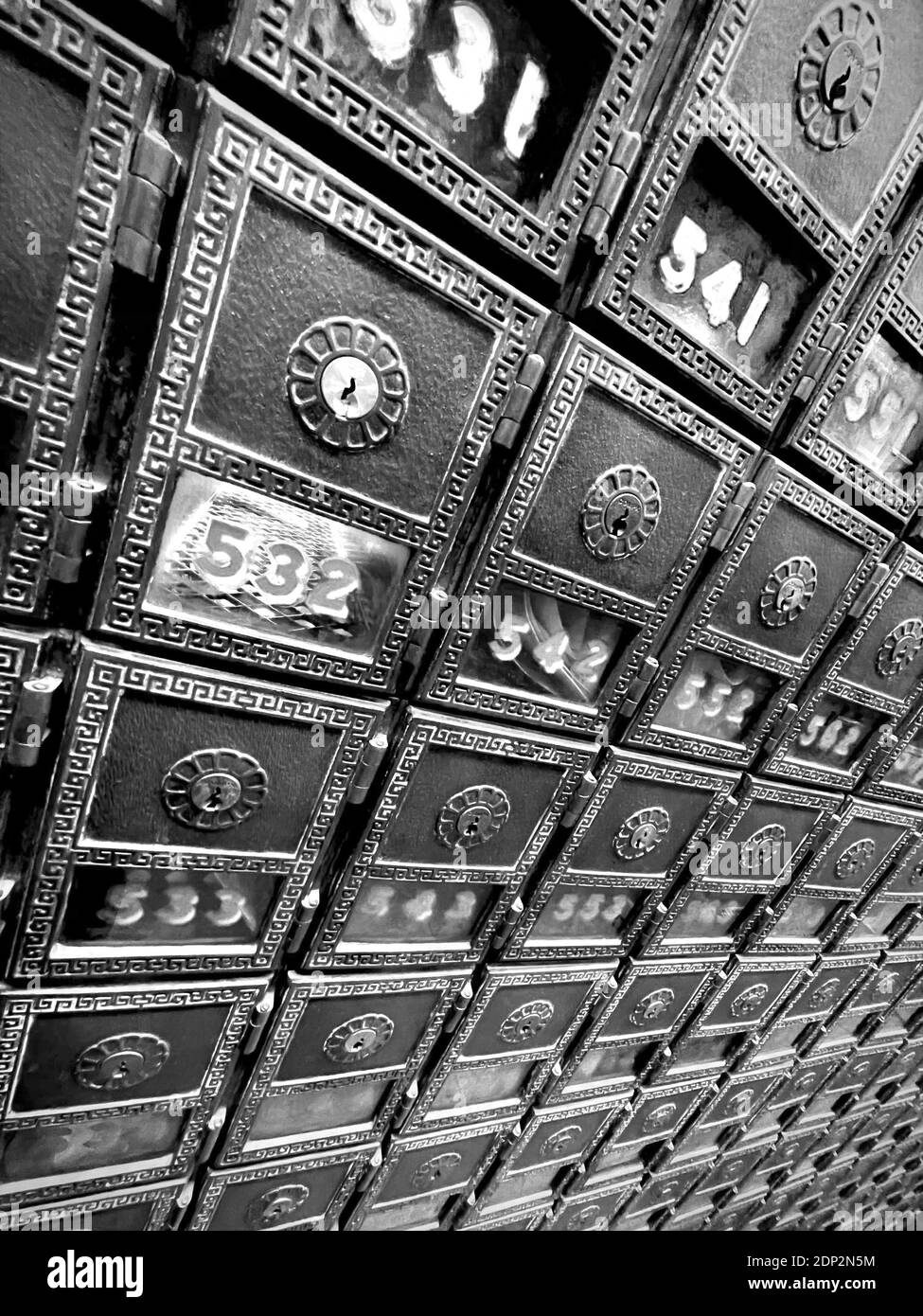 Post Office Boxes in the old Post Office in New York City.  Very dramatic angle with wide angle lens, making for a vanishing point perspective. Stock Photo