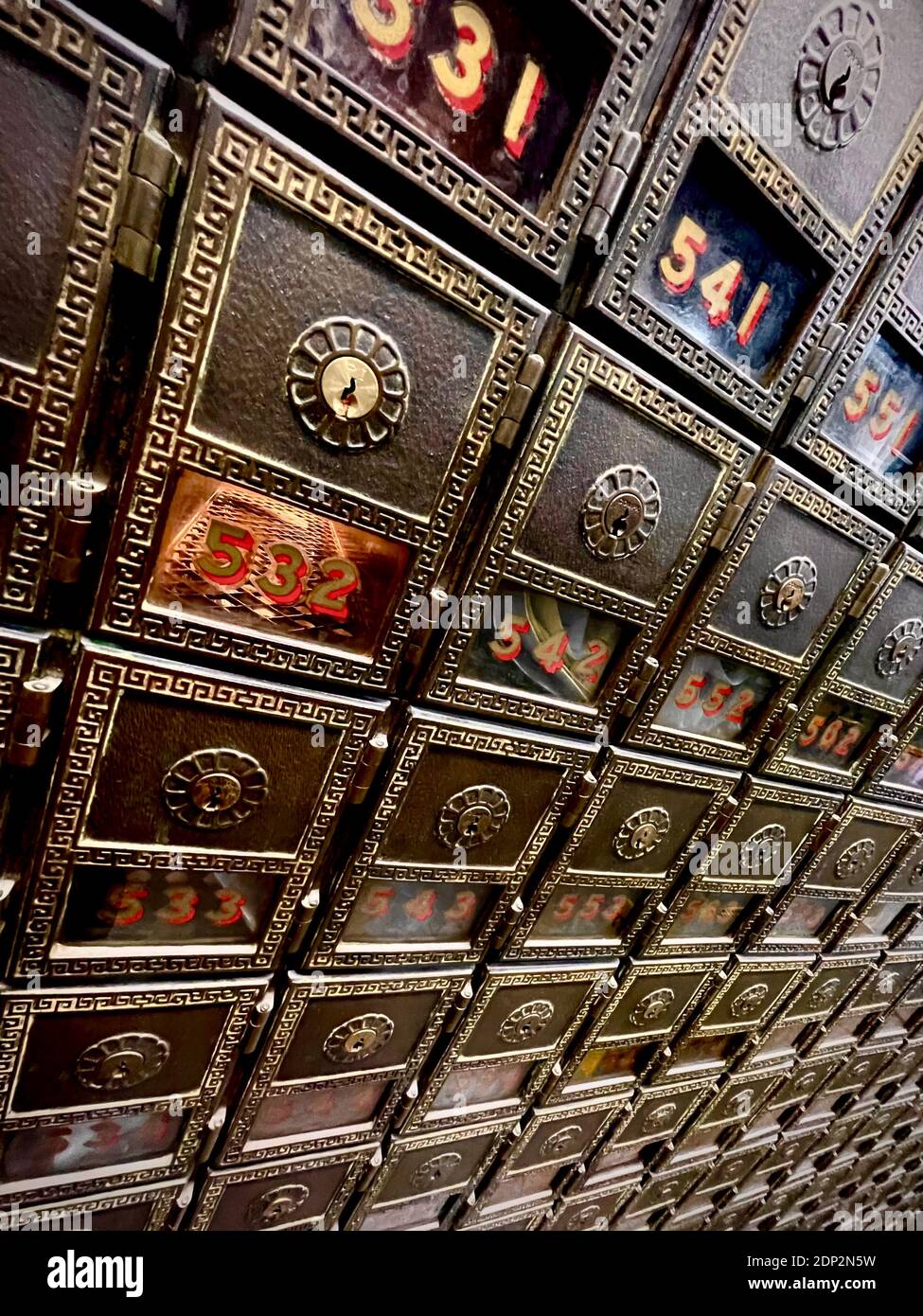 Post Office Boxes in the old Post Office in New York City.  Very dramatic angle with wide angle lens, making for a vanishing point perspective. Stock Photo