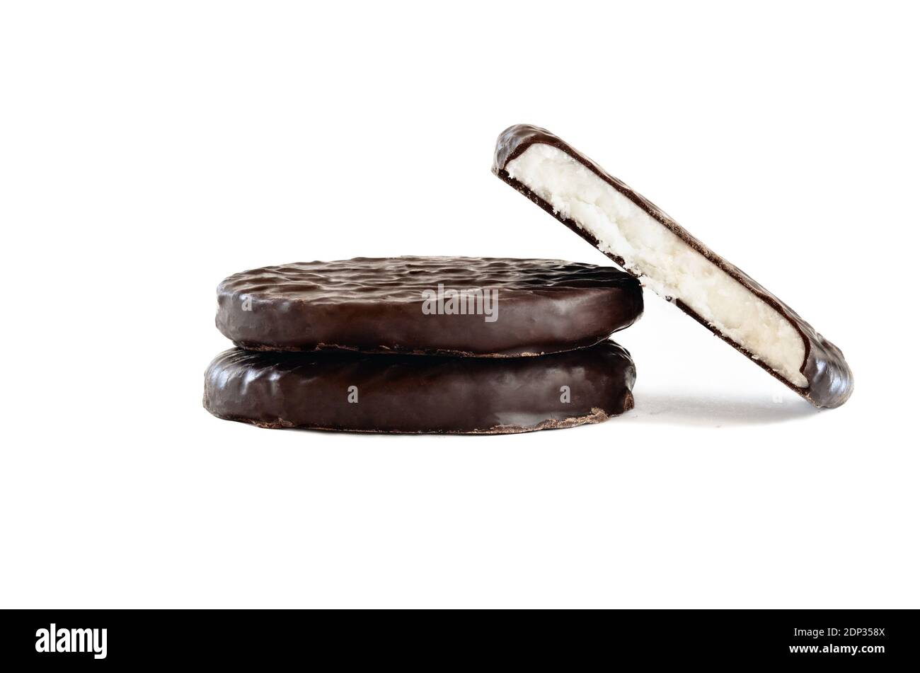 Stack of dark chocolate covered candies with a creamy peppermint filling and missing bite. Isolated over a white background with clipping path include Stock Photo