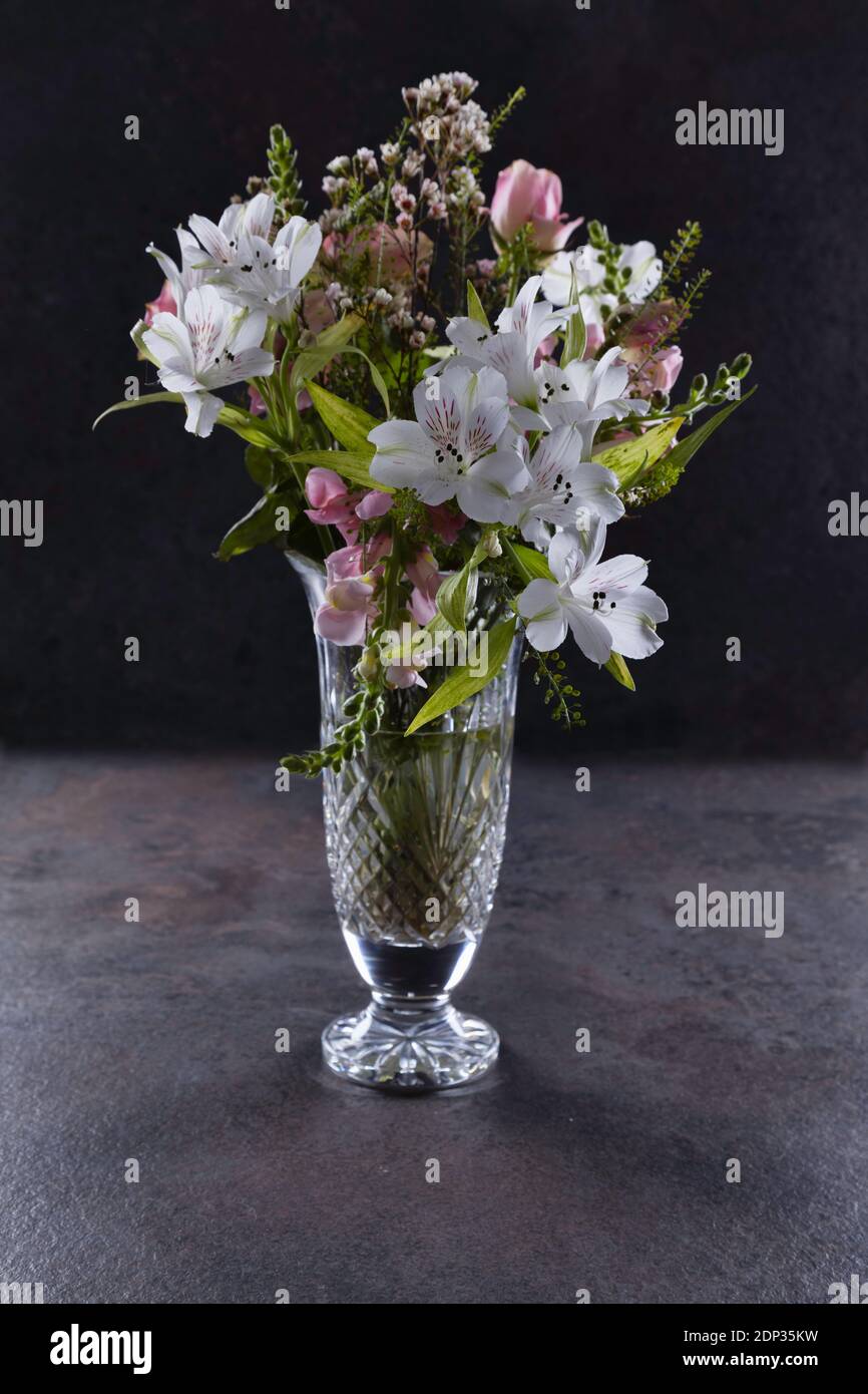 Bouquet of pink and white flowers in a cut glass vase Stock Photo - Alamy