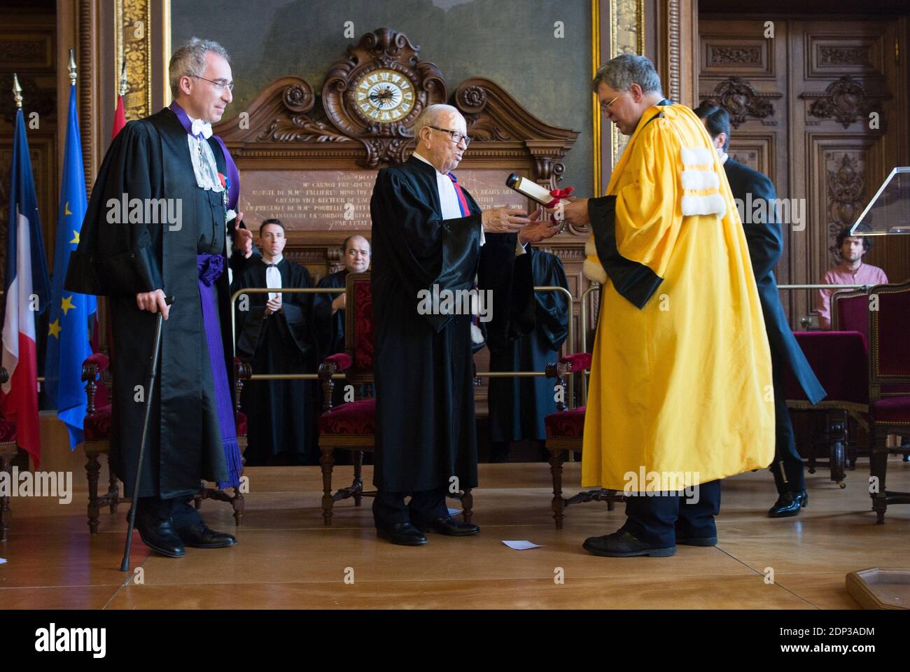 Tunisia's President Beji Caid Essebsi (C) is made doctor honoris causa of  Universite Paris 1 Pantheon-Sorbonne by Sorbonne University president  Philippe Boutry (R) as Paris Academy president Francois Weil looks on during