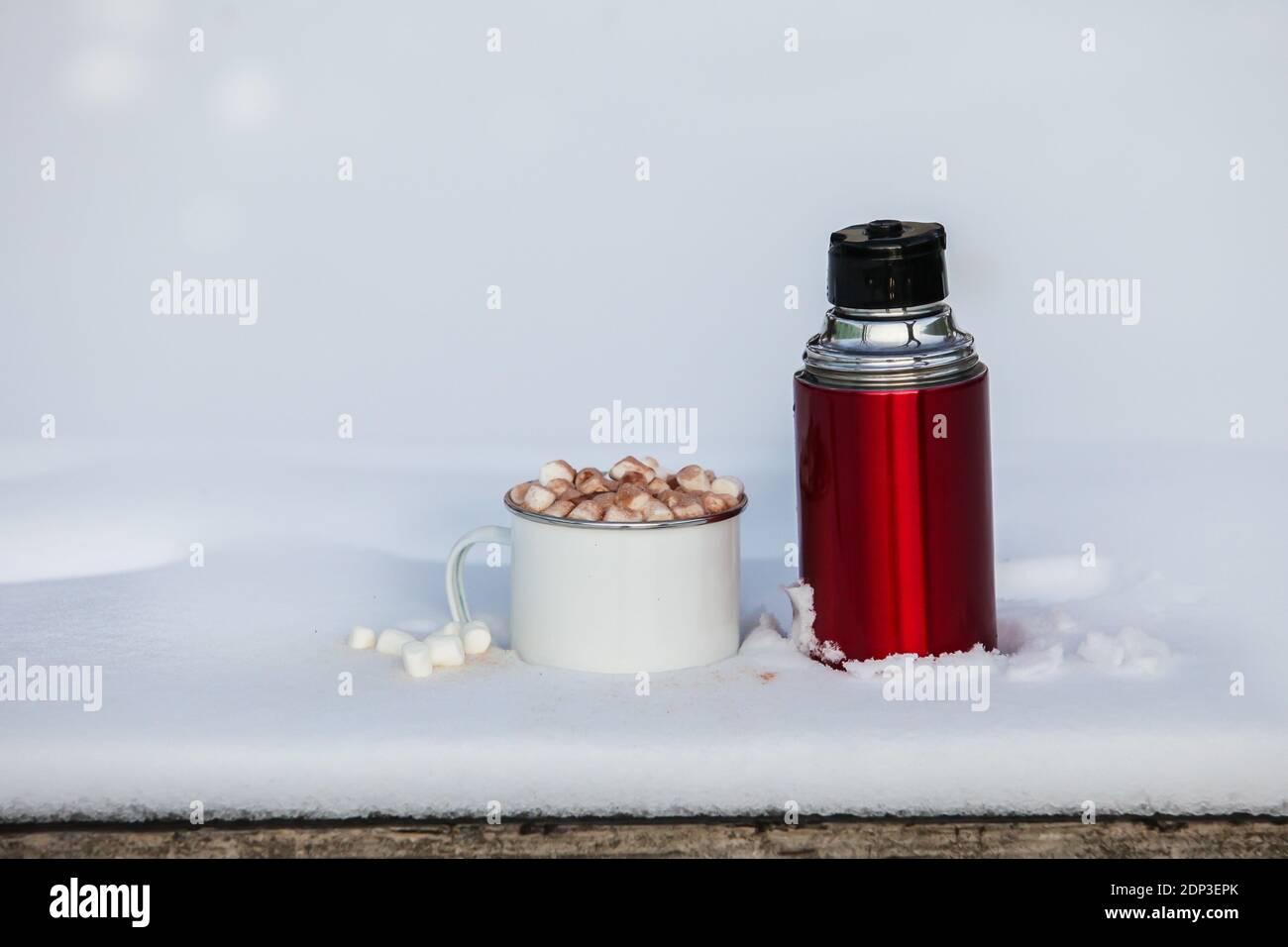 Premium AI Image  A thermos flask with hot chocolate on a mountain  background