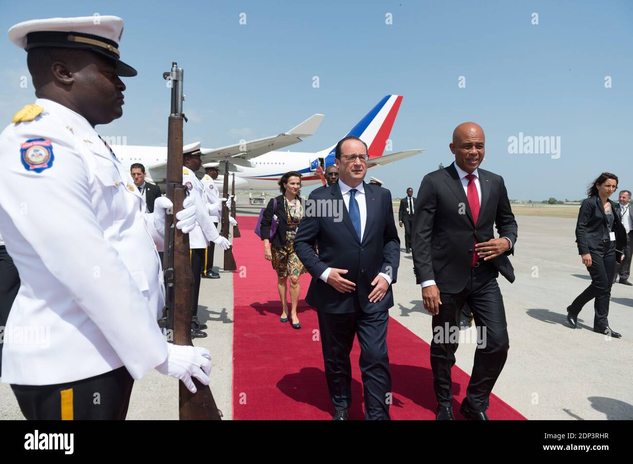 French President Francois Hollande is welcomed by his Haitian counterpart Michel Joseph Martelly as he arrives to Toussaint Louverture international airport in Port-au-Prince, Haiti on May 12, 2015. Hollande is on a five-day tour to the Caribbean including Guadeloupe, Martinique, Cuba and Haiti. Photo by Jacques Witt/Pool/ABACAPRESS.COM Stock Photo