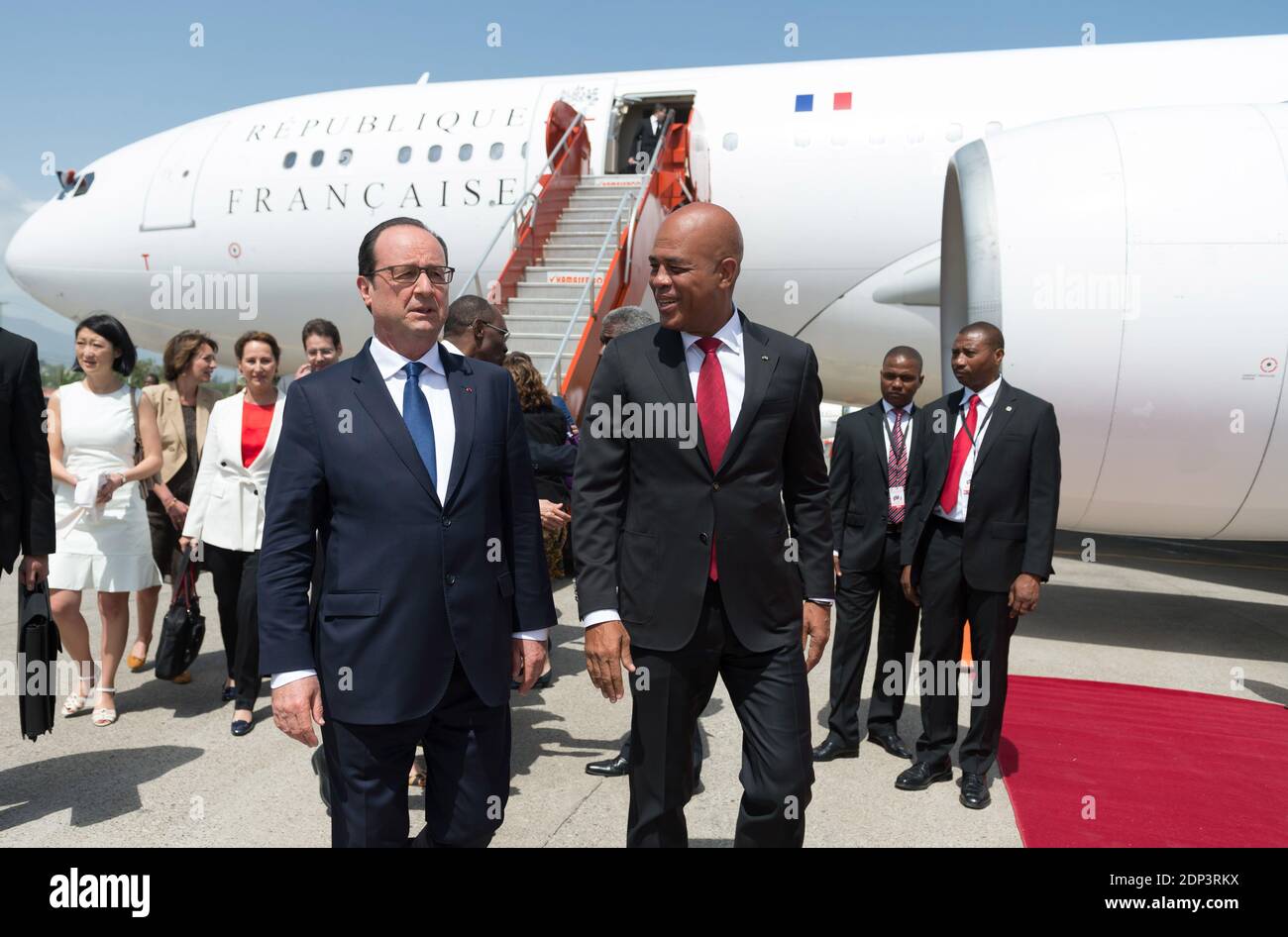 French President Francois Hollande is welcomed by his Haitian counterpart Michel Joseph Martelly as he arrives to Toussaint Louverture international airport in Port-au-Prince, Haiti on May 12, 2015. Hollande is on a five-day tour to the Caribbean including Guadeloupe, Martinique, Cuba and Haiti. Photo by Jacques Witt/Pool/ABACAPRESS.COM Stock Photo