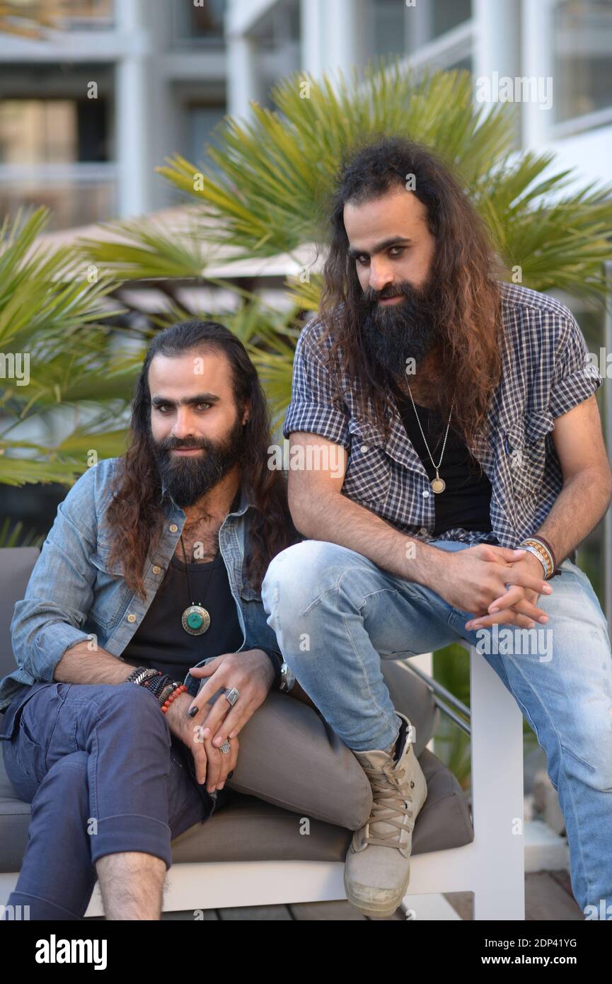 Palestinian twin brothers Tarzan (R) and Arab Nasser, pose in Cannes