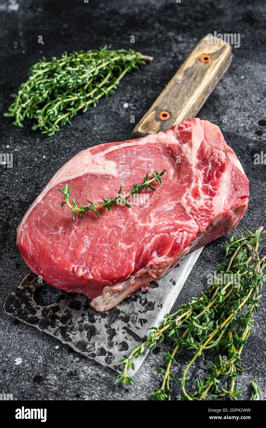 Raw beef club steak. Black ground. Top view Stock Photo Alamy