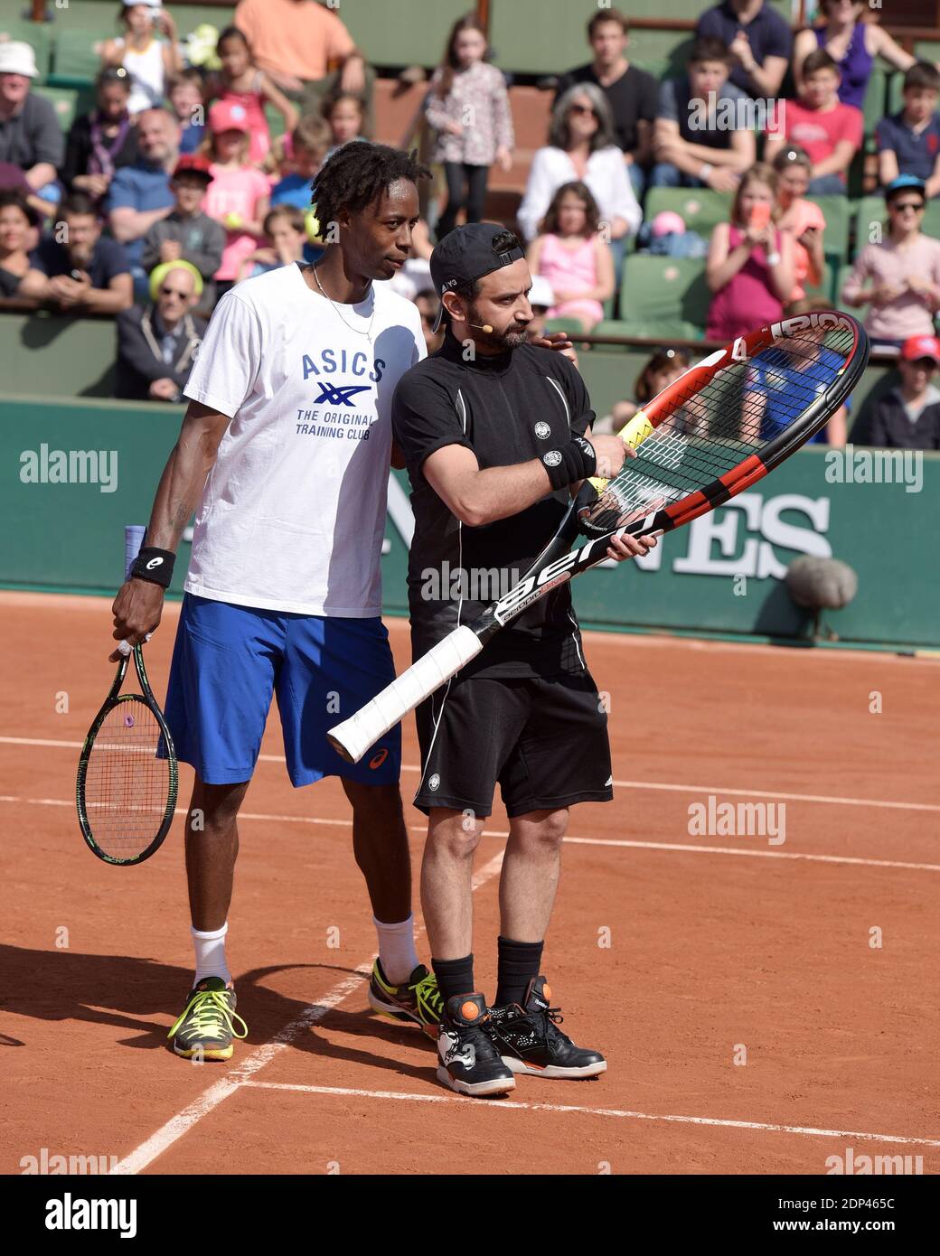 Gael Monfils and Cyril Hanouna during the Kid's Day at Roland Garros  stadium in Paris, France on May 23, 2015, one day before the start of the  French Open tennis tournament. Photo