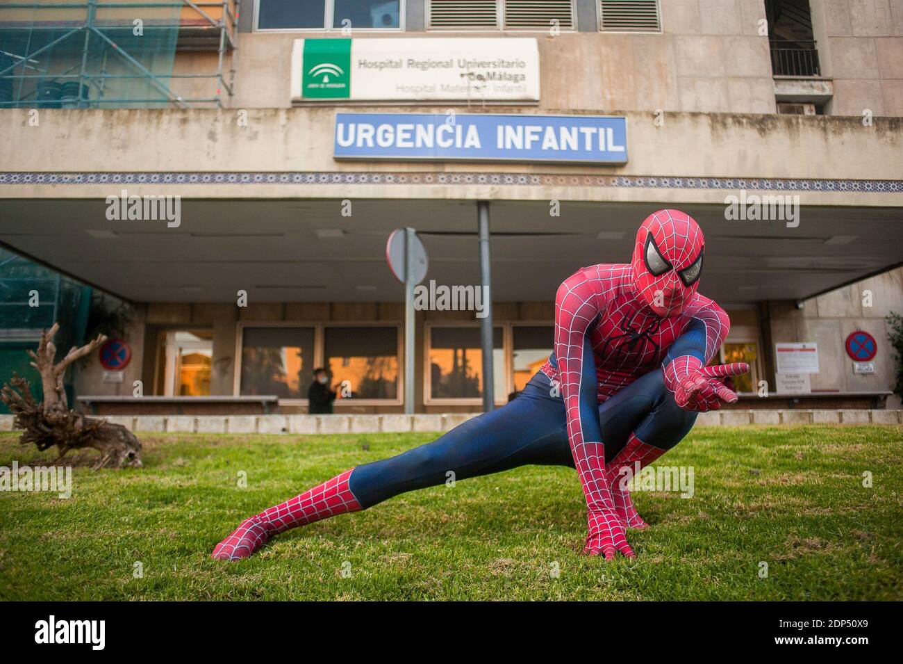 A man dressed as Spiderman poses outside the hospital during the event. The  Andres Olivares Foundation, a NGO that offers support to fight against  children's cancer, have organized a social initiative in