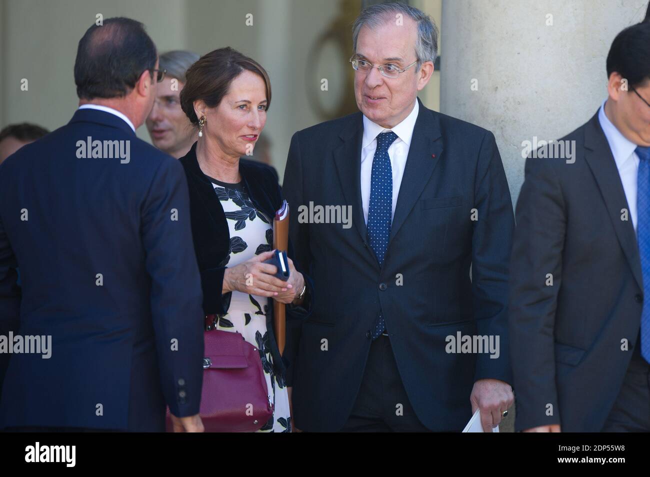 French President Francois Hollande along with Minister of Ecology, Sustainable Development and Energy Segolene Royal and France's ambassador to China Maurice Gourdault-Montagne after a meeting and a lunch at the Elysee Palace, in Paris, France on June 30, 2015. Li Keqiang begins a three-day visit to France expected to be dominated by climate talks and the sealing of dozens of economic agreements between both nations. Photo by Thierry Orban/ABACAPRESS.COM Stock Photo