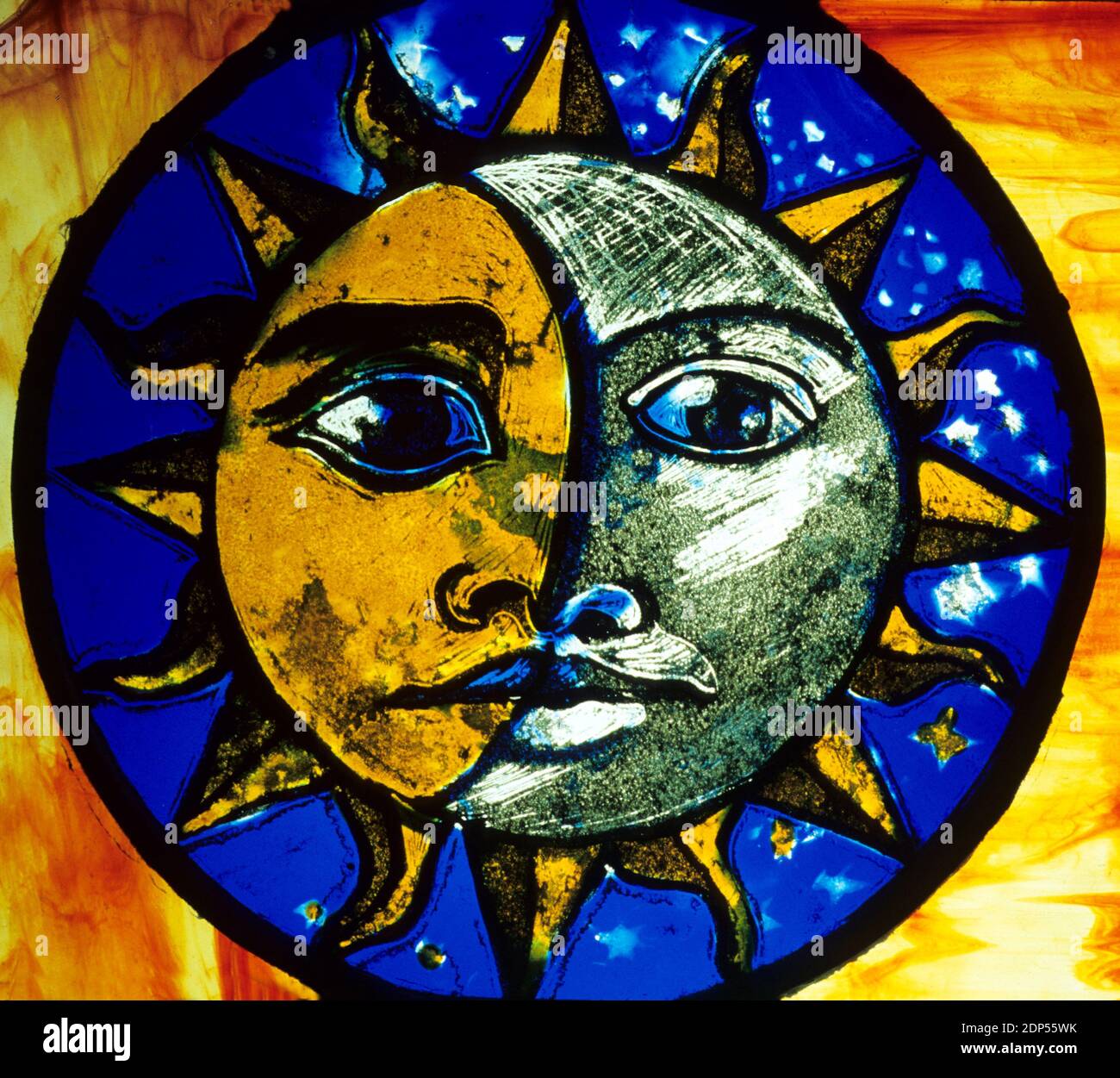 Ely Cathedral, Stained Glass, Sun and Moon, human face, modern glass, Cambridgeshire, England Stock Photo