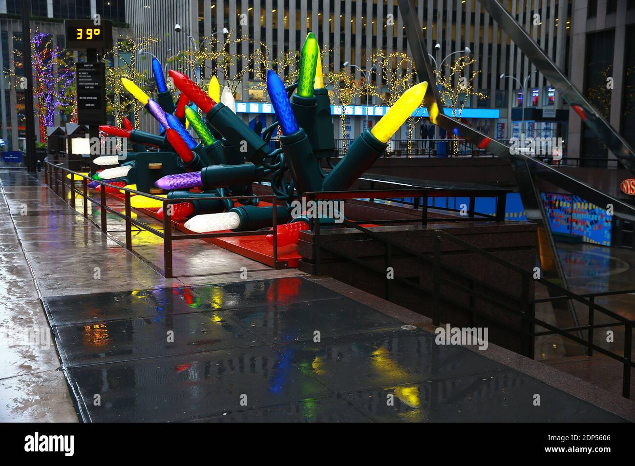 Giant Christmas lights line the sidewalk near Radio City Music Hall in