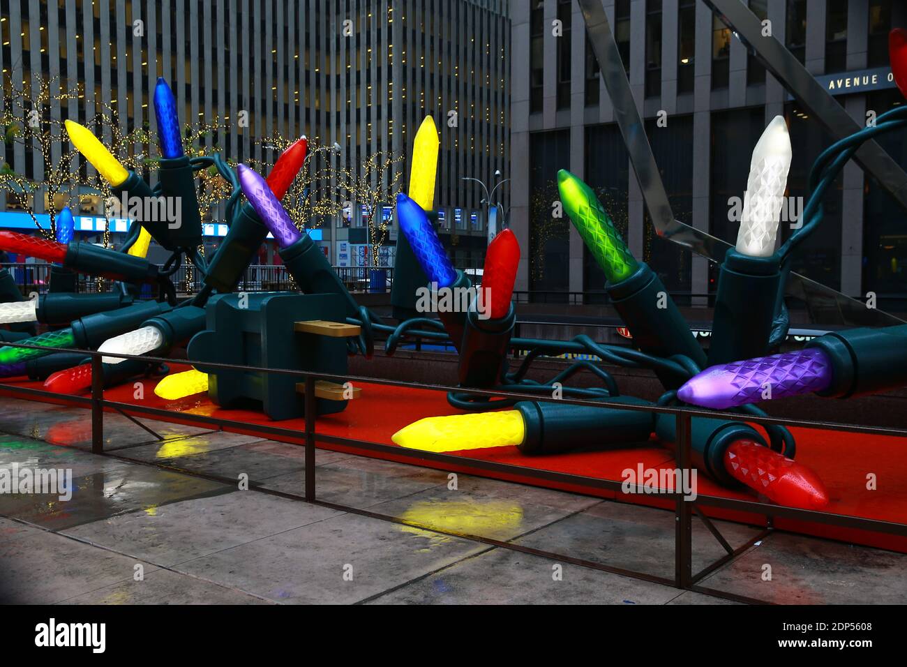 Giant Christmas lights line the sidewalk near Radio City Music Hall in