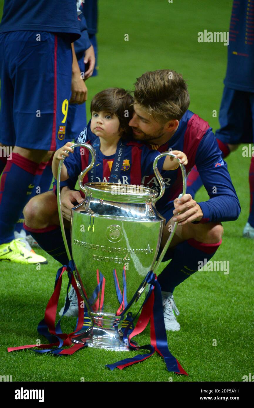 Barcelona's Gerard Pique poses with the trophy after the