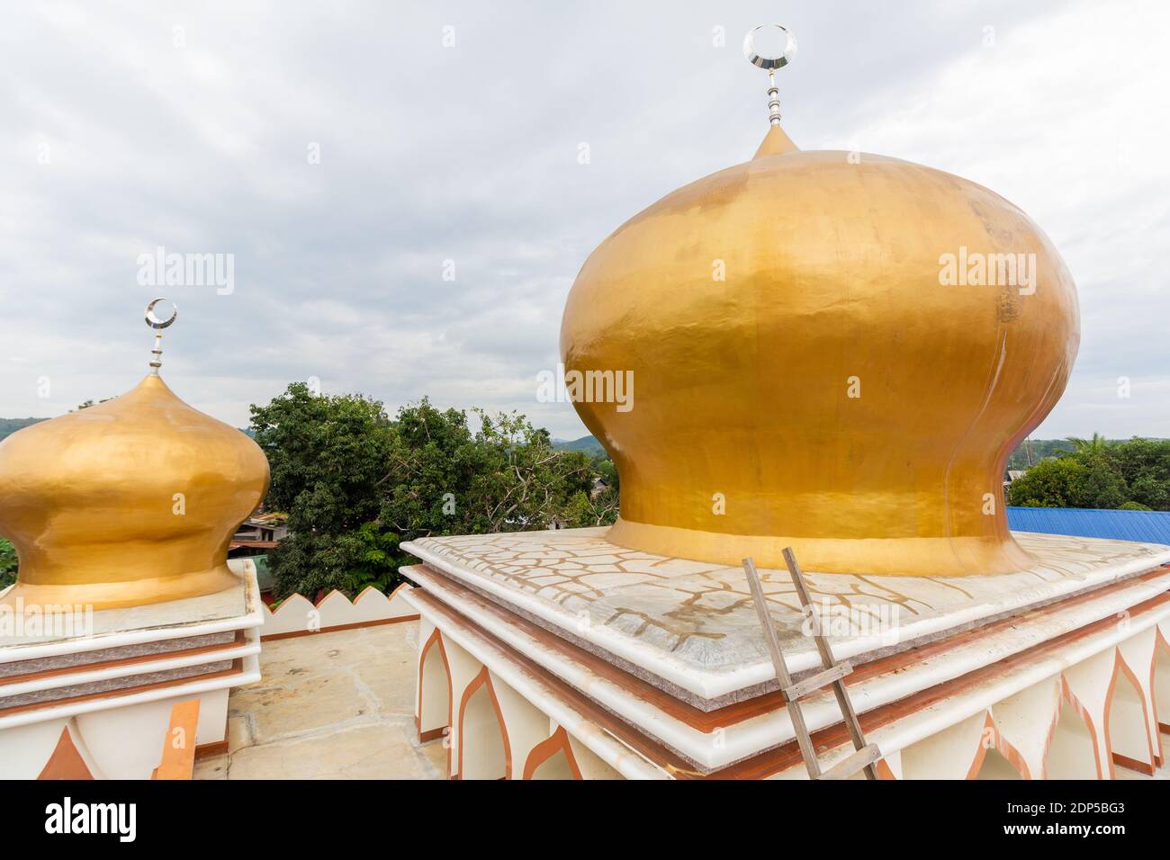 The golden domes of a local mosque in Basilan Island, Philippines Stock Photo