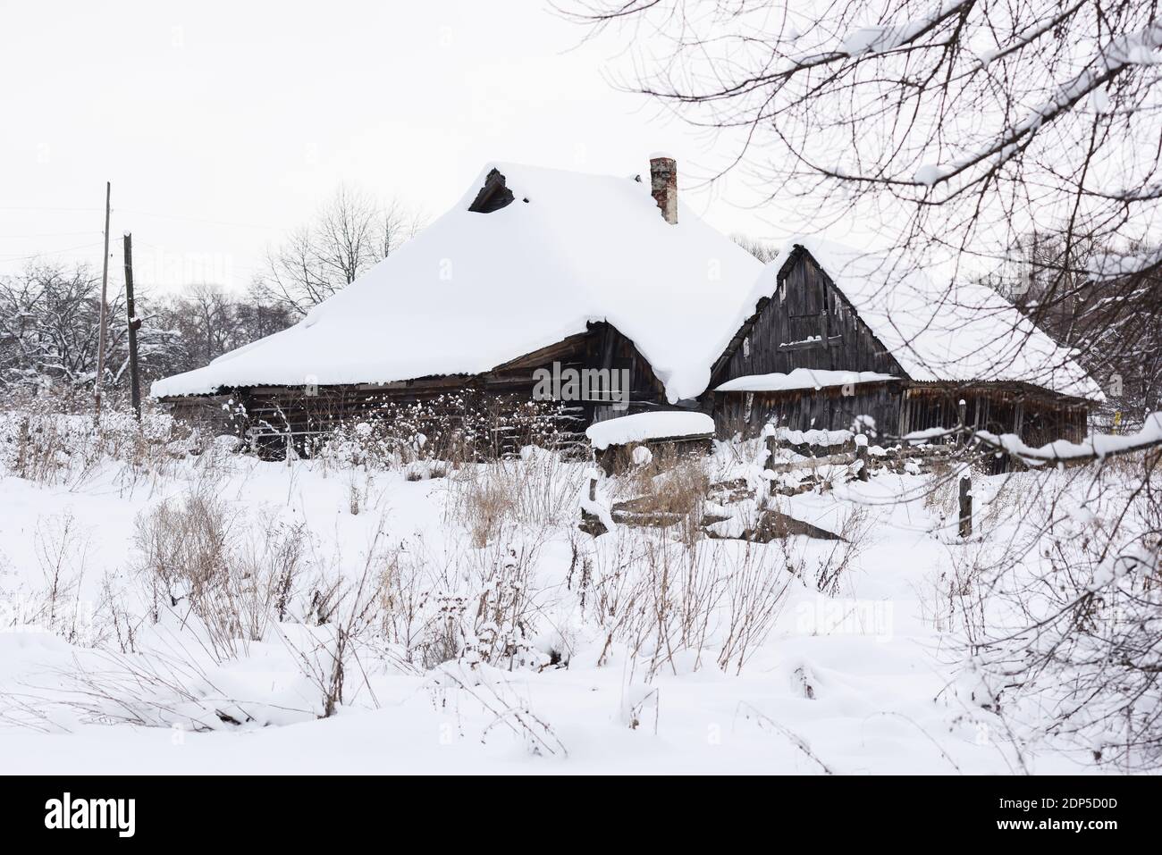 Winter landscape. Old abandoned village houses in deep snow copyspace ...