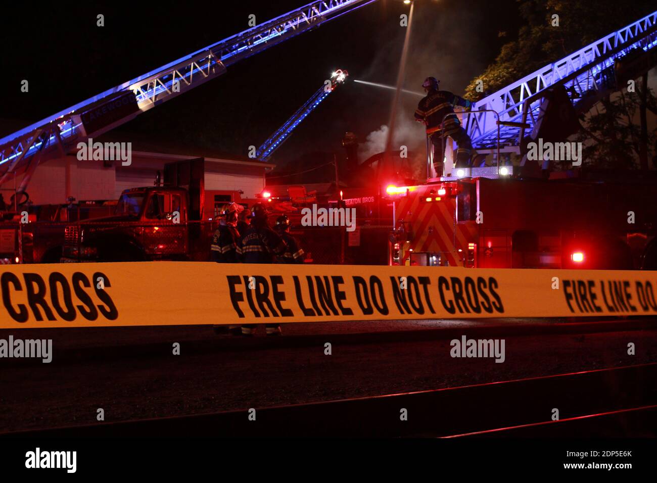Police and fireline tape to keep people out of a scene or danger. Stock Photo