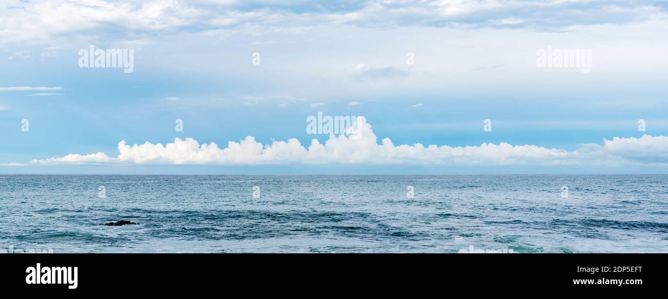 A banner or panoramic image of a long Stratocumulus cloud formation low and close the the east coast of New South Wales, Australia in October 2020 Stock Photo