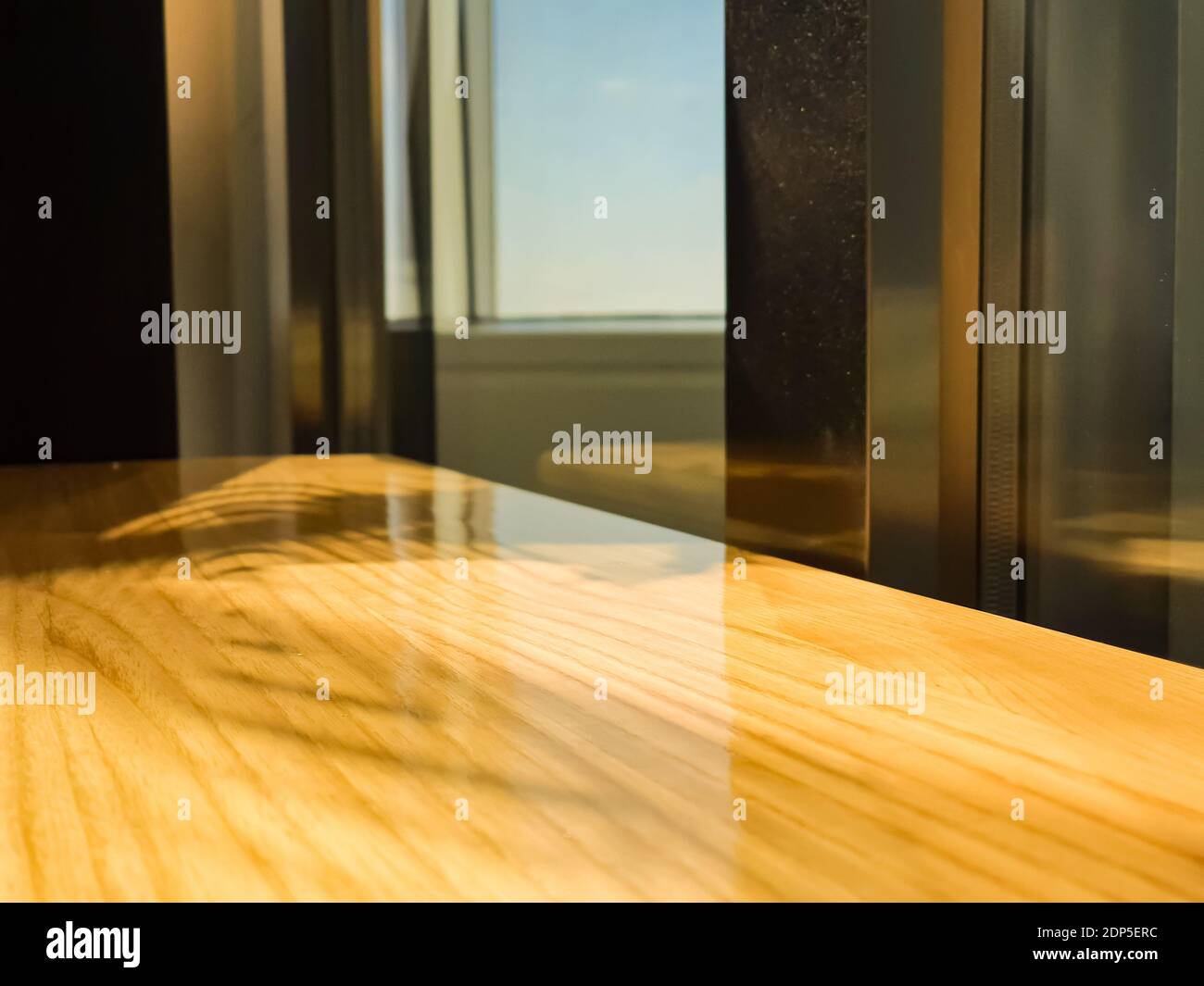 Image showcasing Sparkling wooden tables and sparkling gold structures Stock Photo - Alamy