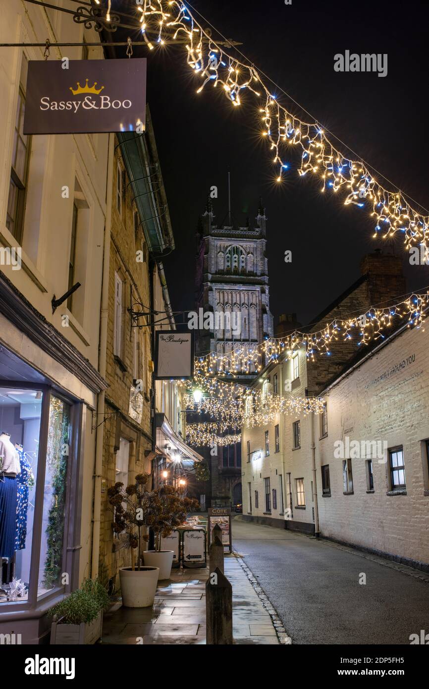 Christmas lights at night along Black Jack Street. Cirencester, Cotswolds, Gloucestershire, England Stock Photo